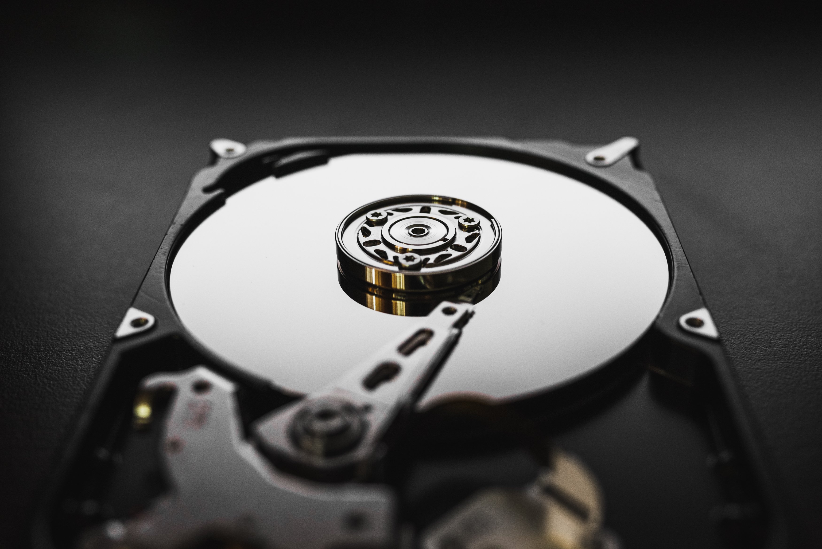 disassembled-hard-drive-from-computer-hdd-with-mirror-effects-part-computer-pc-laptop (1)